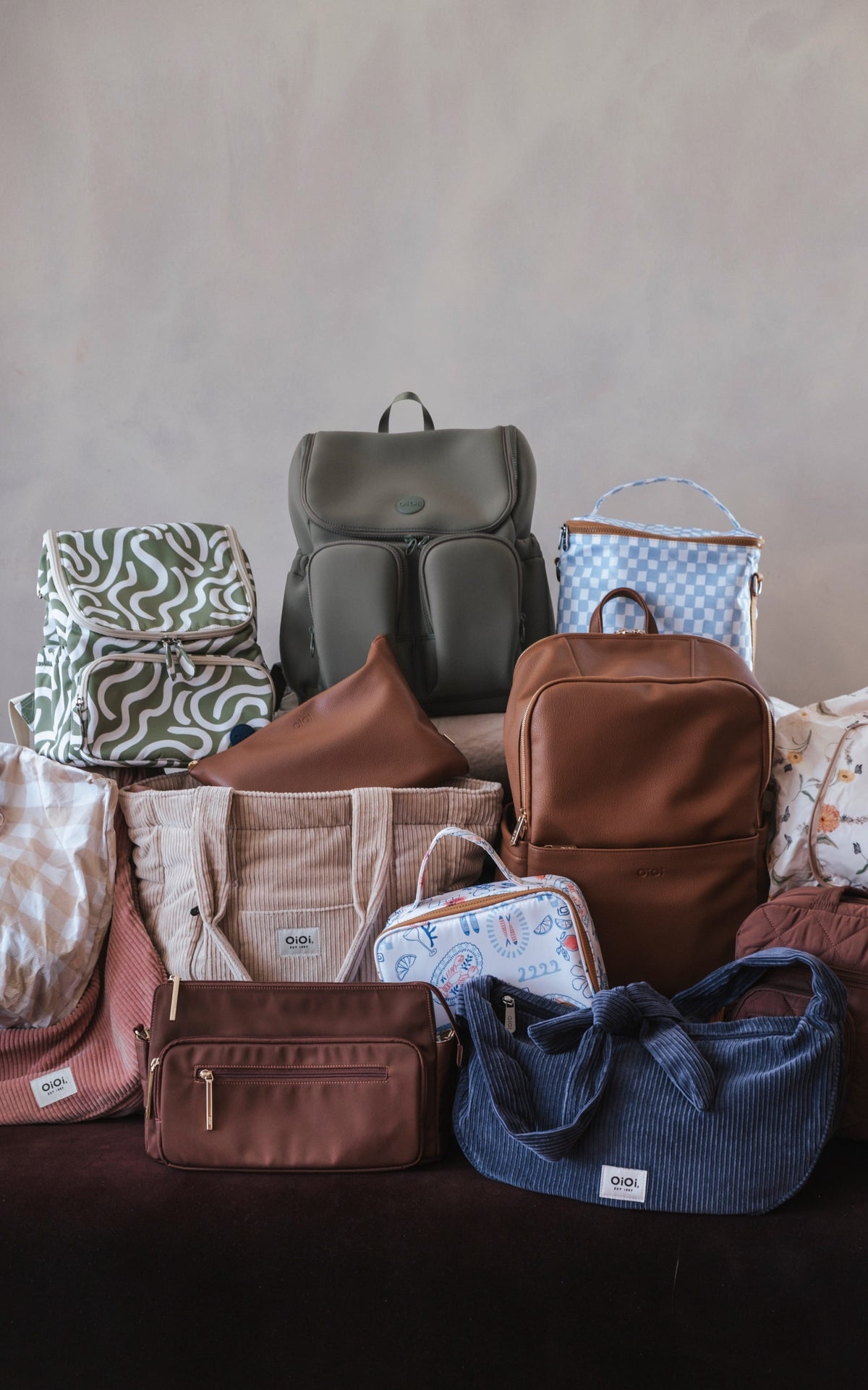 A pile of OiOi bags and backpacks