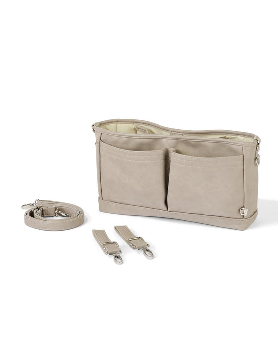 a taupe pram caddy sits next to a cross-body strap and pram clips